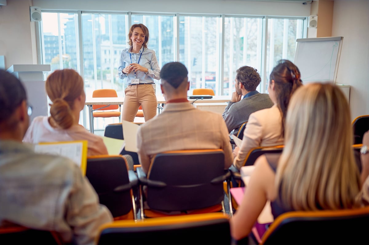 Senior business woman presenting at conference