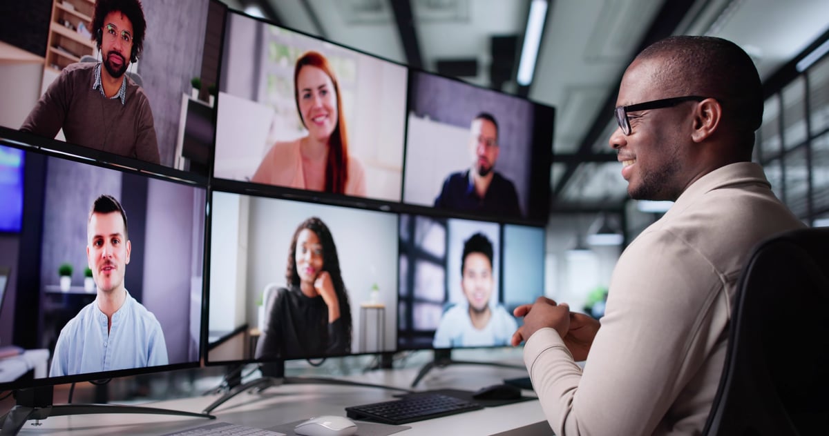 Virtual business meeting with diverse executives on video call